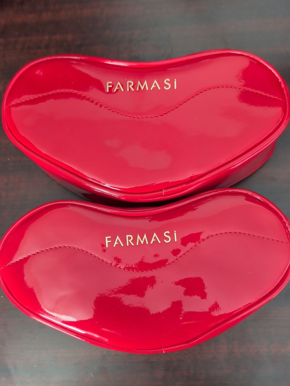 Farmasi Glossy Red Heart-Shaped Makeup Case with Gold Logo